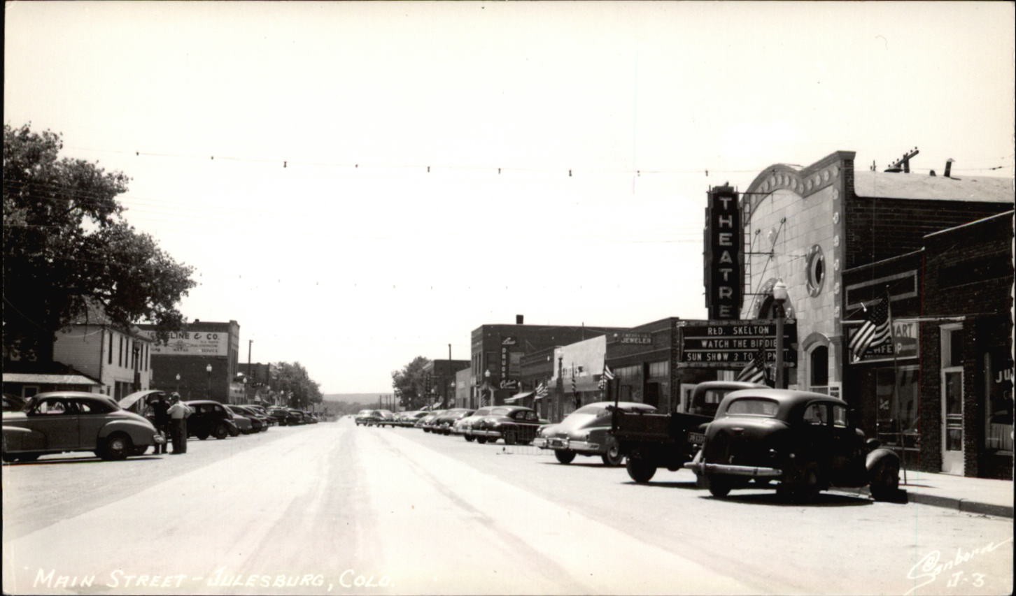 RPPC Main Street Julesburg Colorado theatre Red Skelton TRIMMED real photo PC