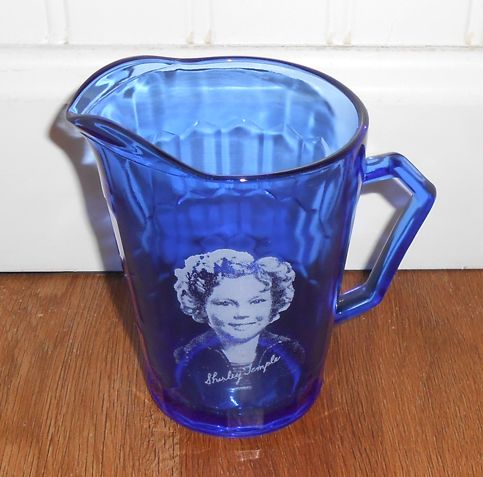 UNBRANDED COLBALT BLUE SHIRLEY TEMPLE PITCHER WITH HER PICTURE ON SIDE
