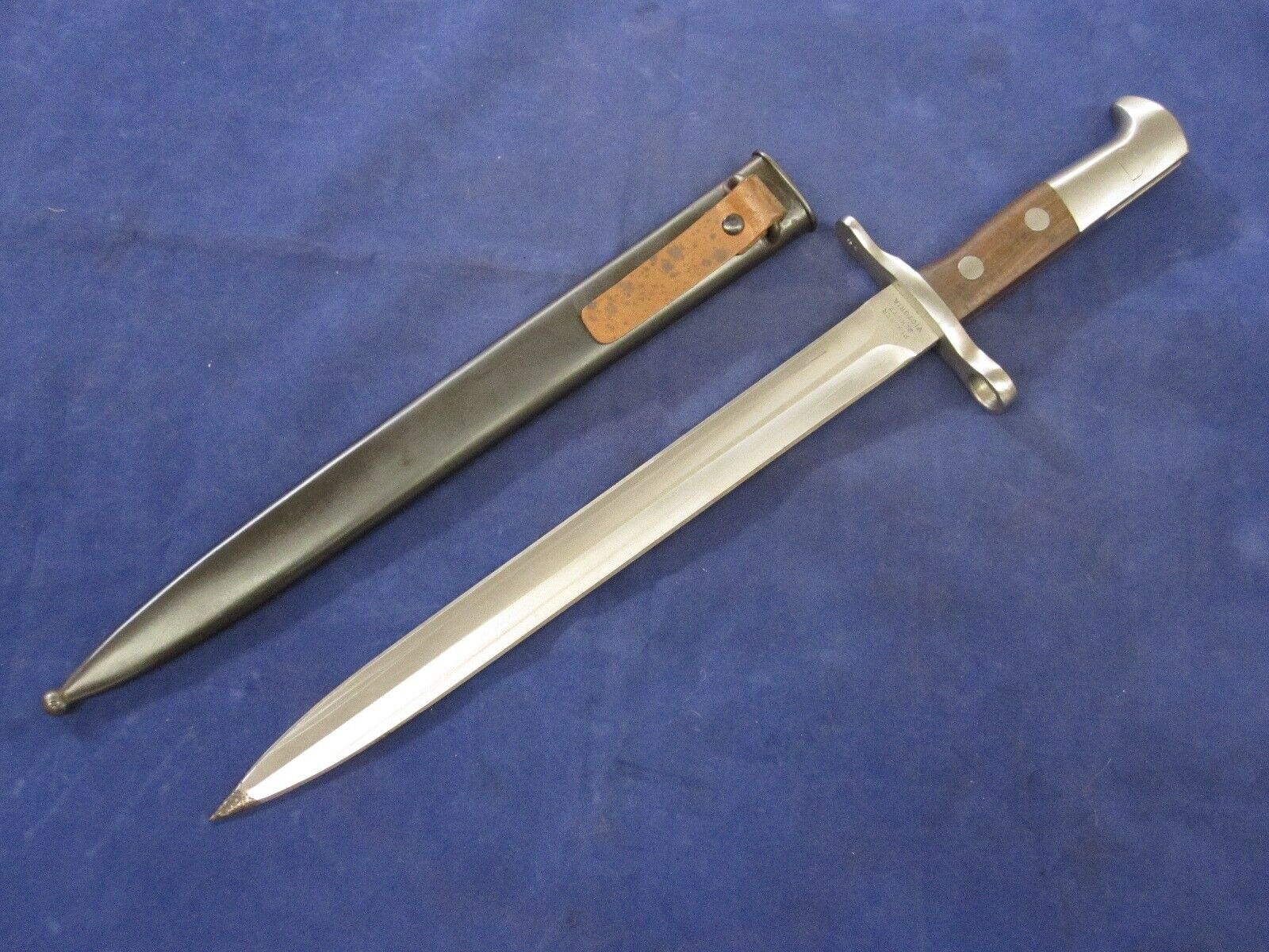 One Swiss K31 Bayonet with Scabbard - No Serials, Unissued - Blemished.