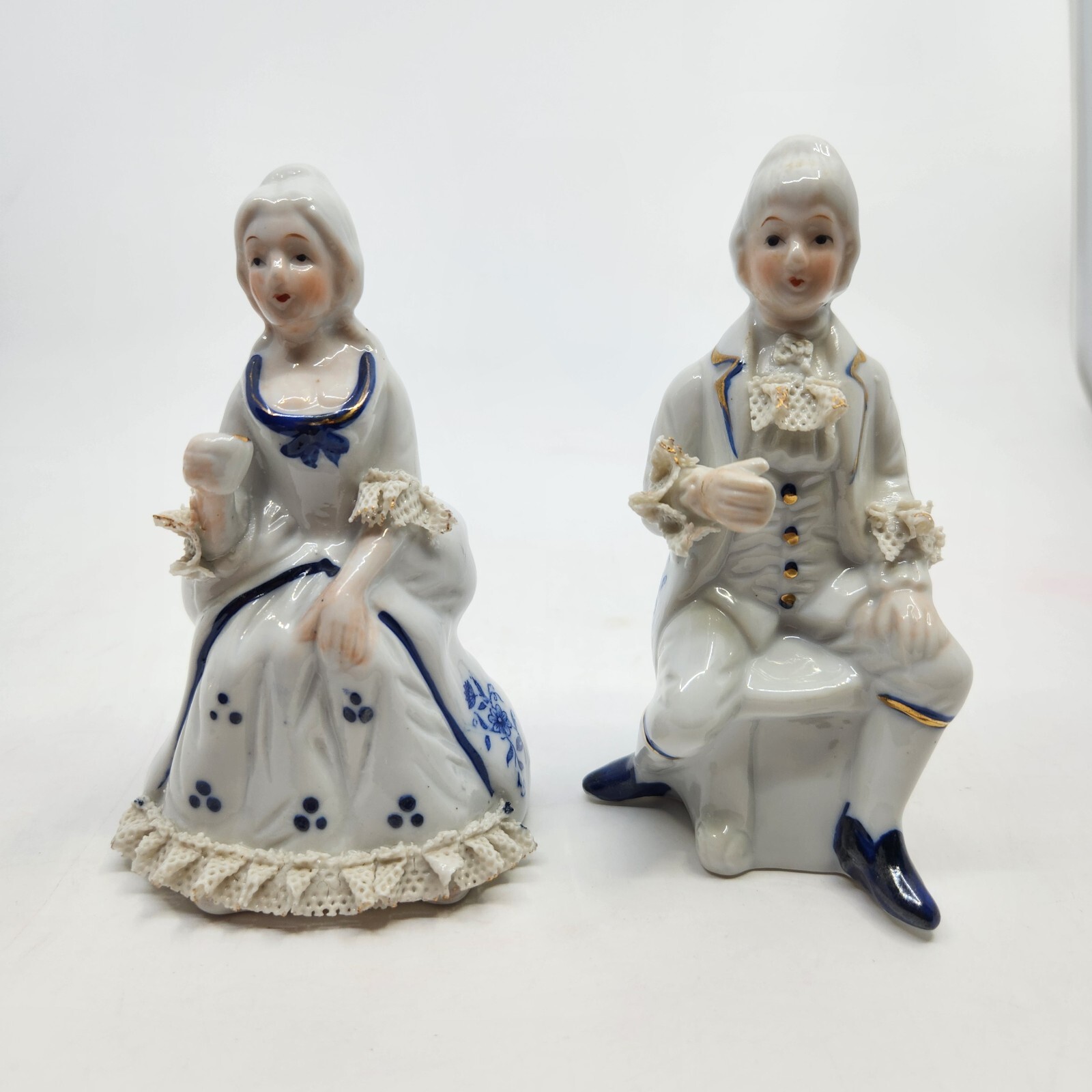 2 Vintage Colonial Victorian Seated Porcelain Figurines Ruffled Sleeves Couple