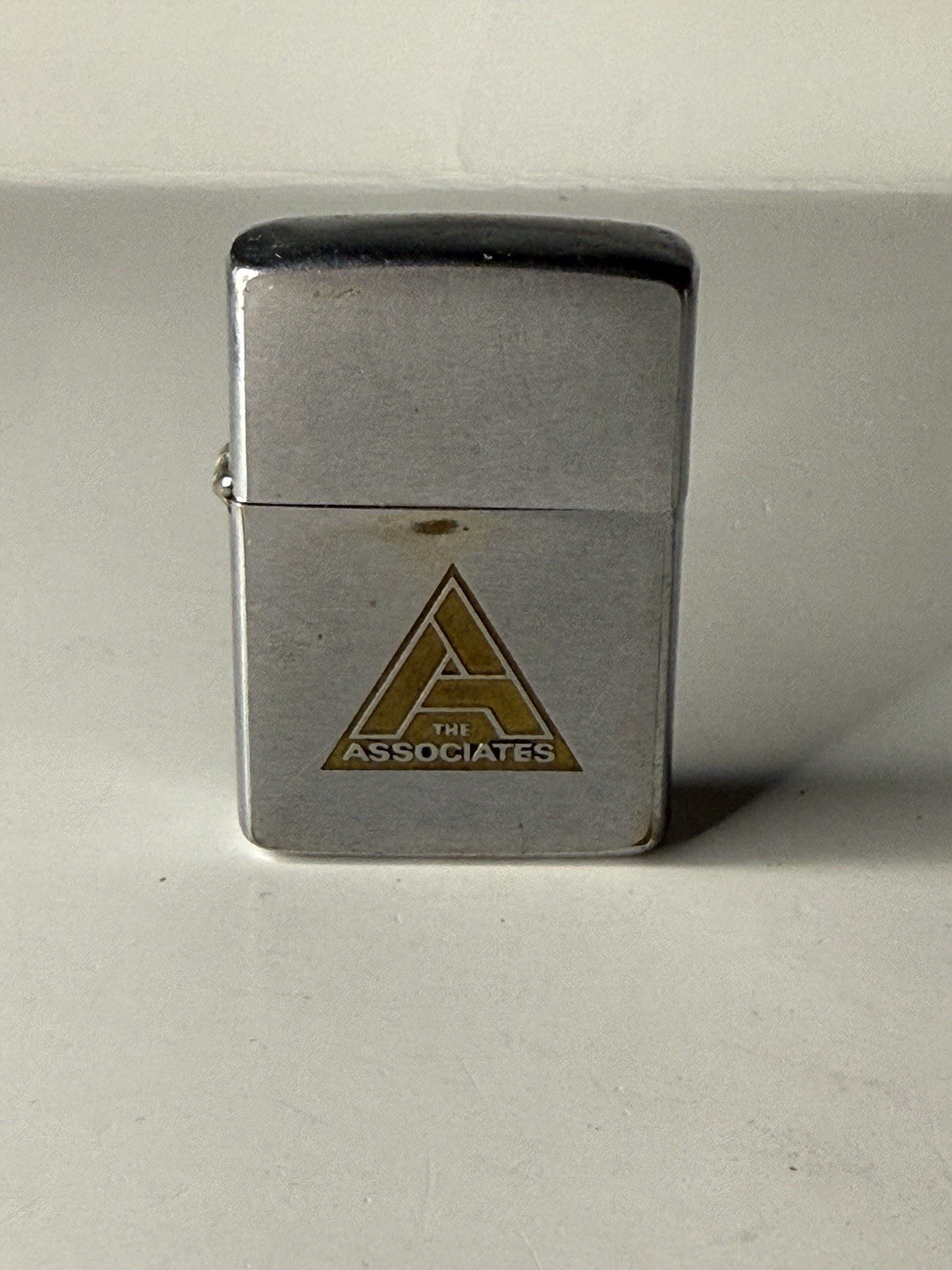 Vintage 1960s “The Associates” Advertising Zippo