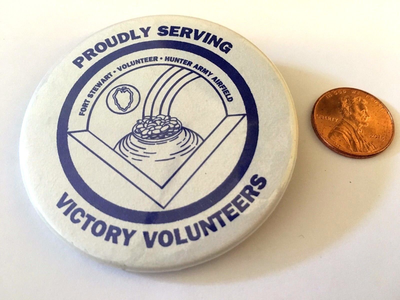 PROUDLY SERVING VICTORY VOLUNTEERS PIN PINBACK FORT STEWART HUNTER ARMY AIRFIELD