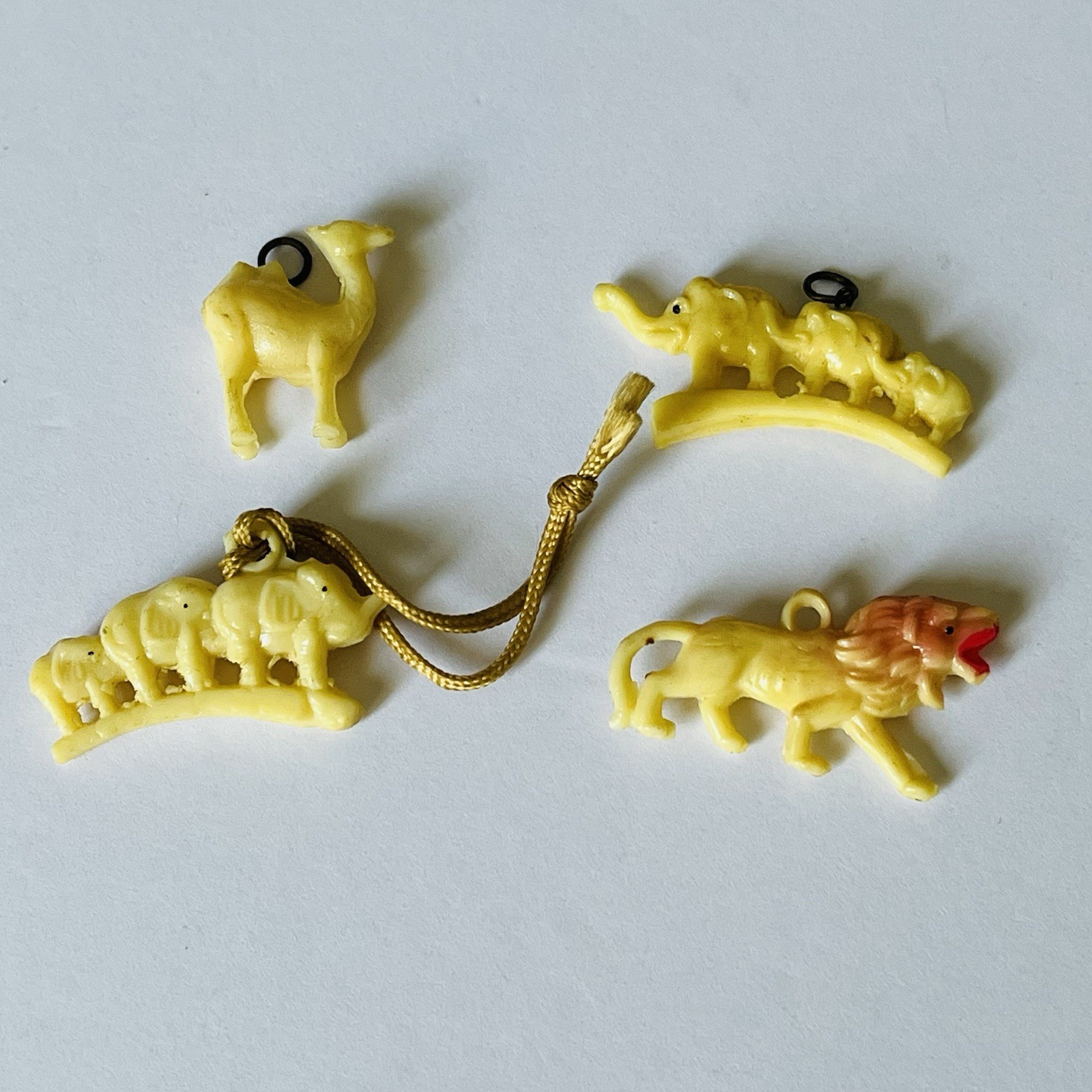 Lot-4 ATQ VTG Cracker Jack Charms Elephants, Camel, Lion Celluloid Early 1900's Lot-4 ATQ VTG Cracker Jack Charms Elephants, Camel, Lion Celluloid Early 1900's