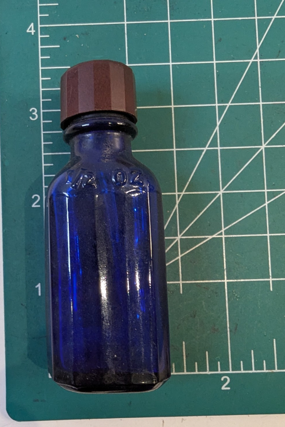 Vintage Cobalt Blue Empty Bottle Cobalt Glass 1/2 Oz with Brown Screw Cap Vintage Cobalt Blue Empty Bottle Cobalt Glass 1/2 Oz with Brown Screw Cap