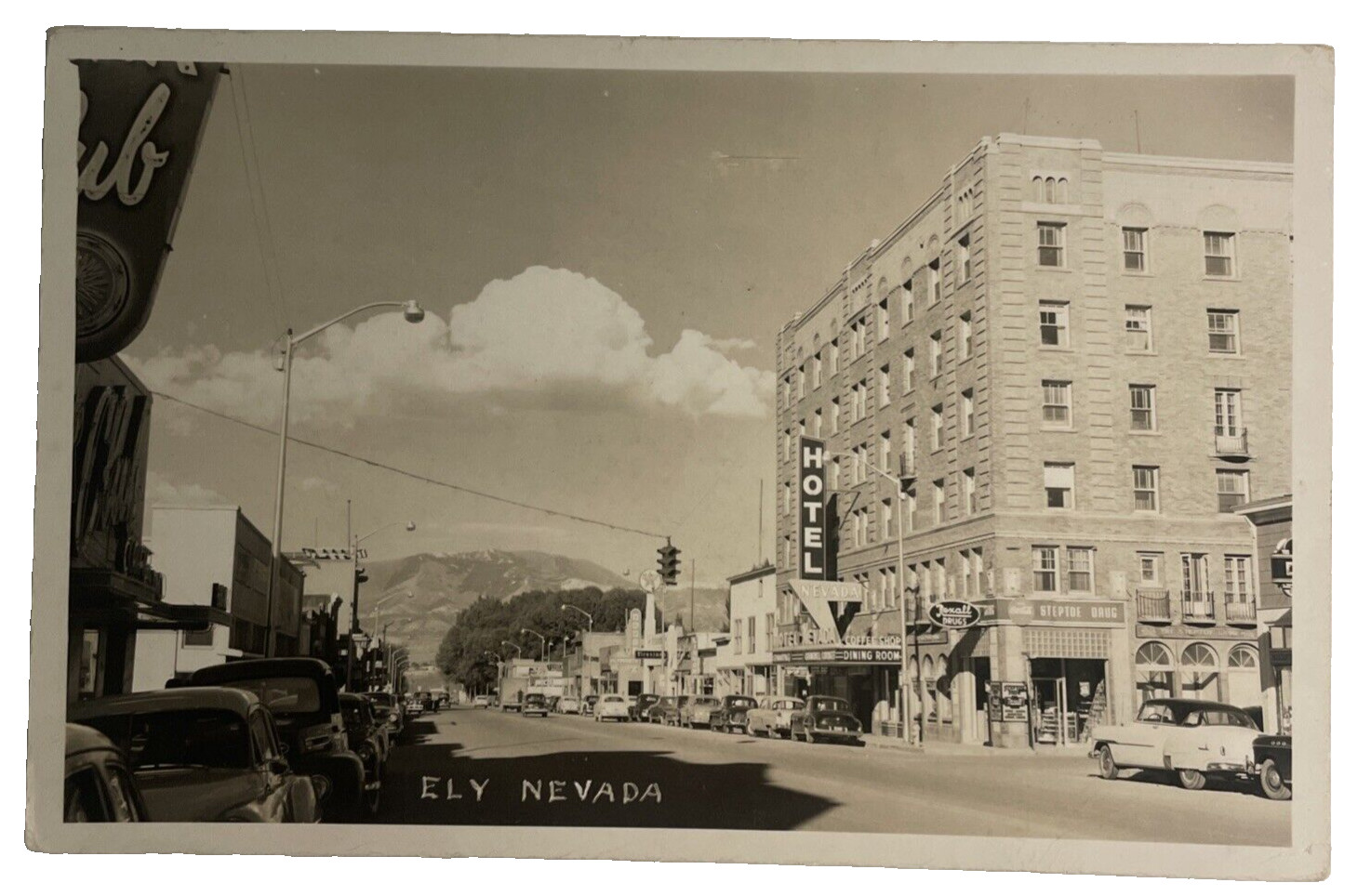 ELY NEVADA DOWNTOWN STREET SCENE OLD CARS REAL PHOTO RPPC