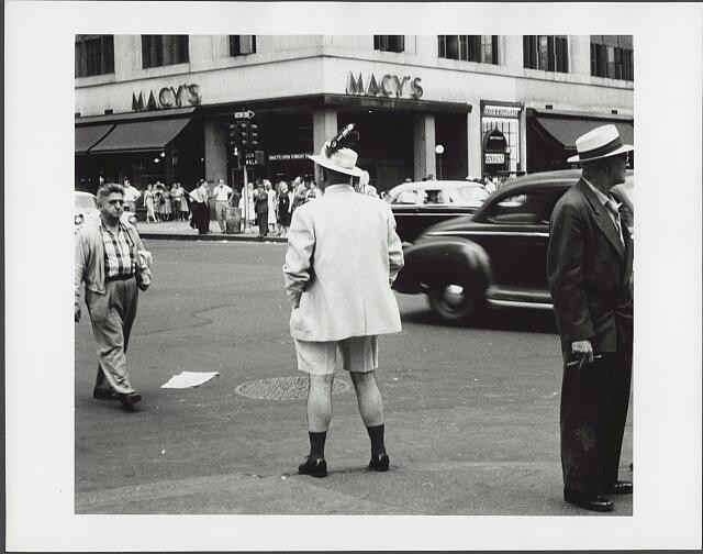 Photo:New York City Macy\'s 1957 Man in Shorts Feathered Hat Street Scene