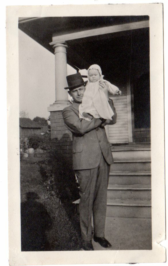 vintage 1900/10s snapshot photo man in top hat scared holding baby on shoulder