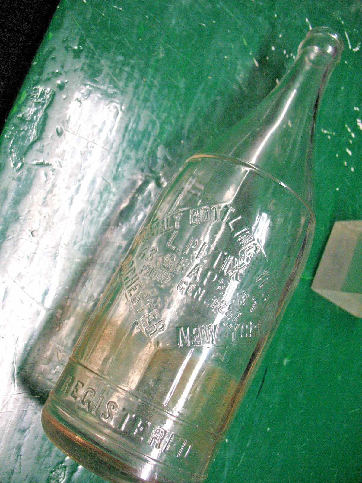 FAMILY BOTTLING  WKS ROCHESTER  N Y PHONE GEN 4257 CLEAR GLASS BOTTLE 1 PT 14 OZ