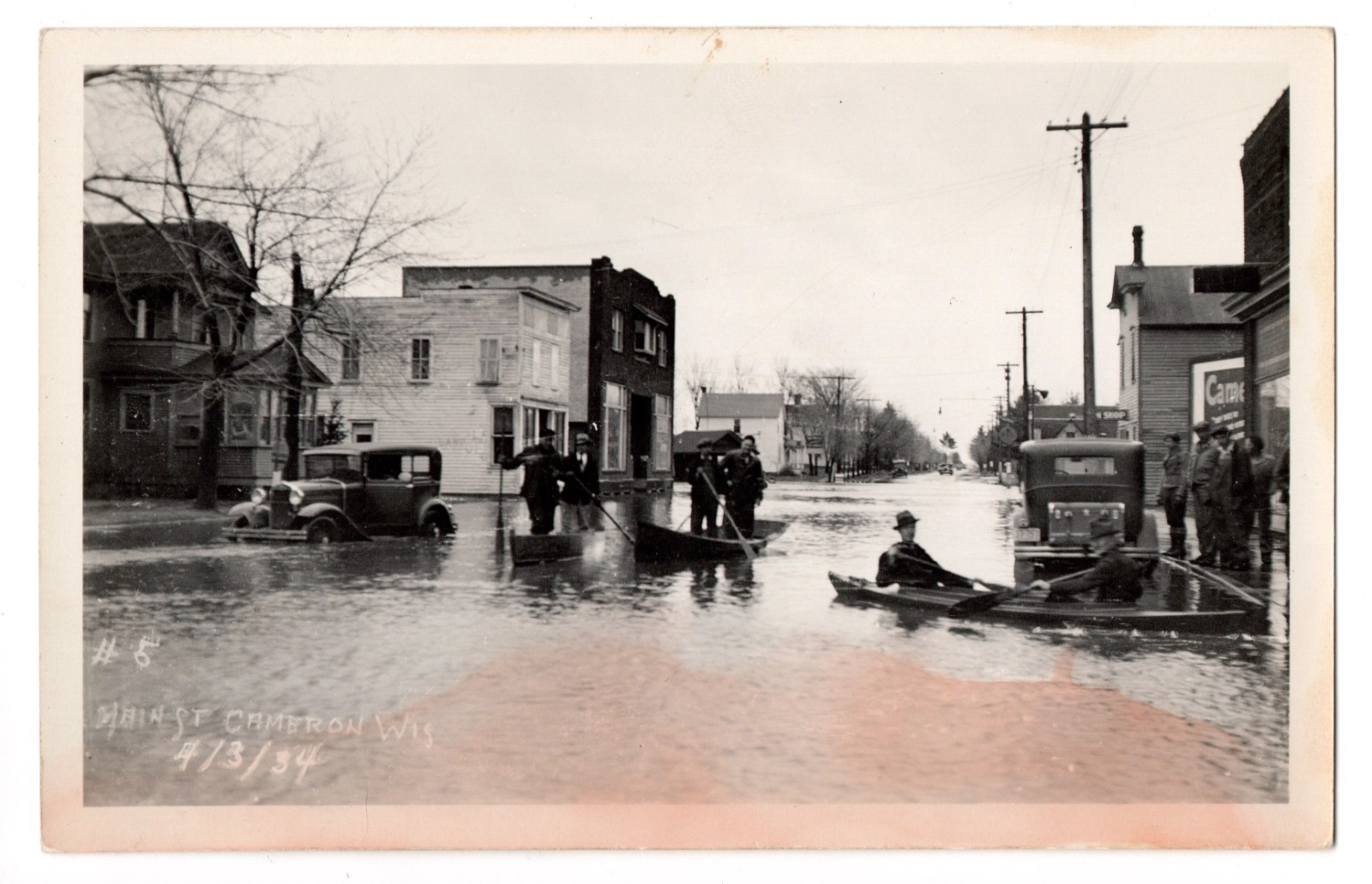 Vintage Cameron Wisconsin Flood Men Canoeing in Main St Cars RPPC Postcard 1934