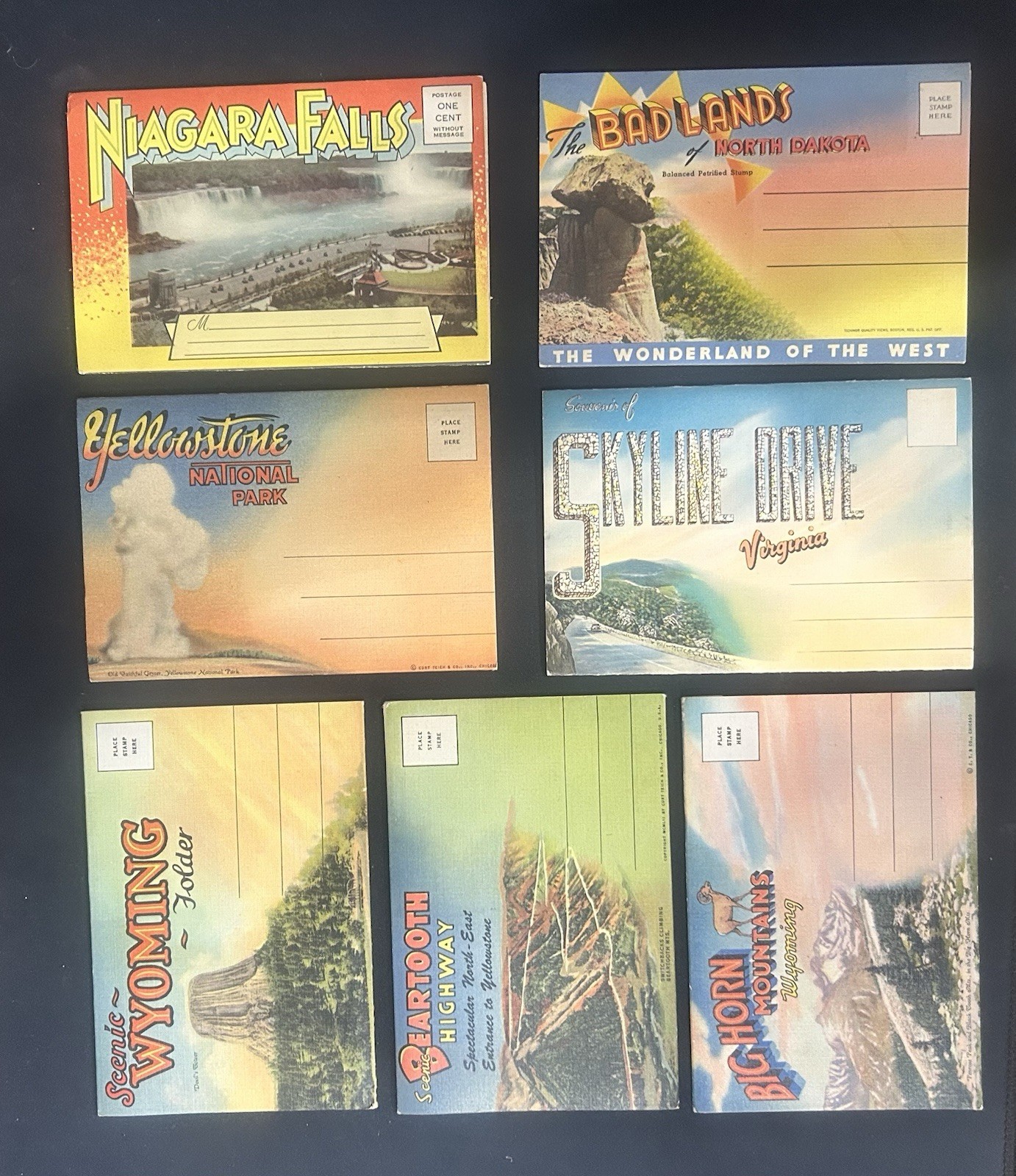 7 vintage linen souvenir postcard folders w/ fold out photo strips inside.