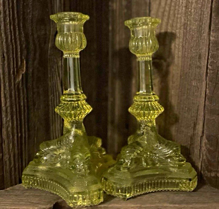 Vaseline glass dolphin candlestick holders. Super rare find