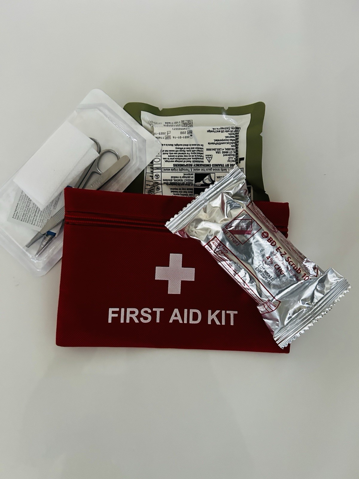 Small First AD Bag That Includes 2 QuikClot  (2031) and 1 Suture removal tray. 