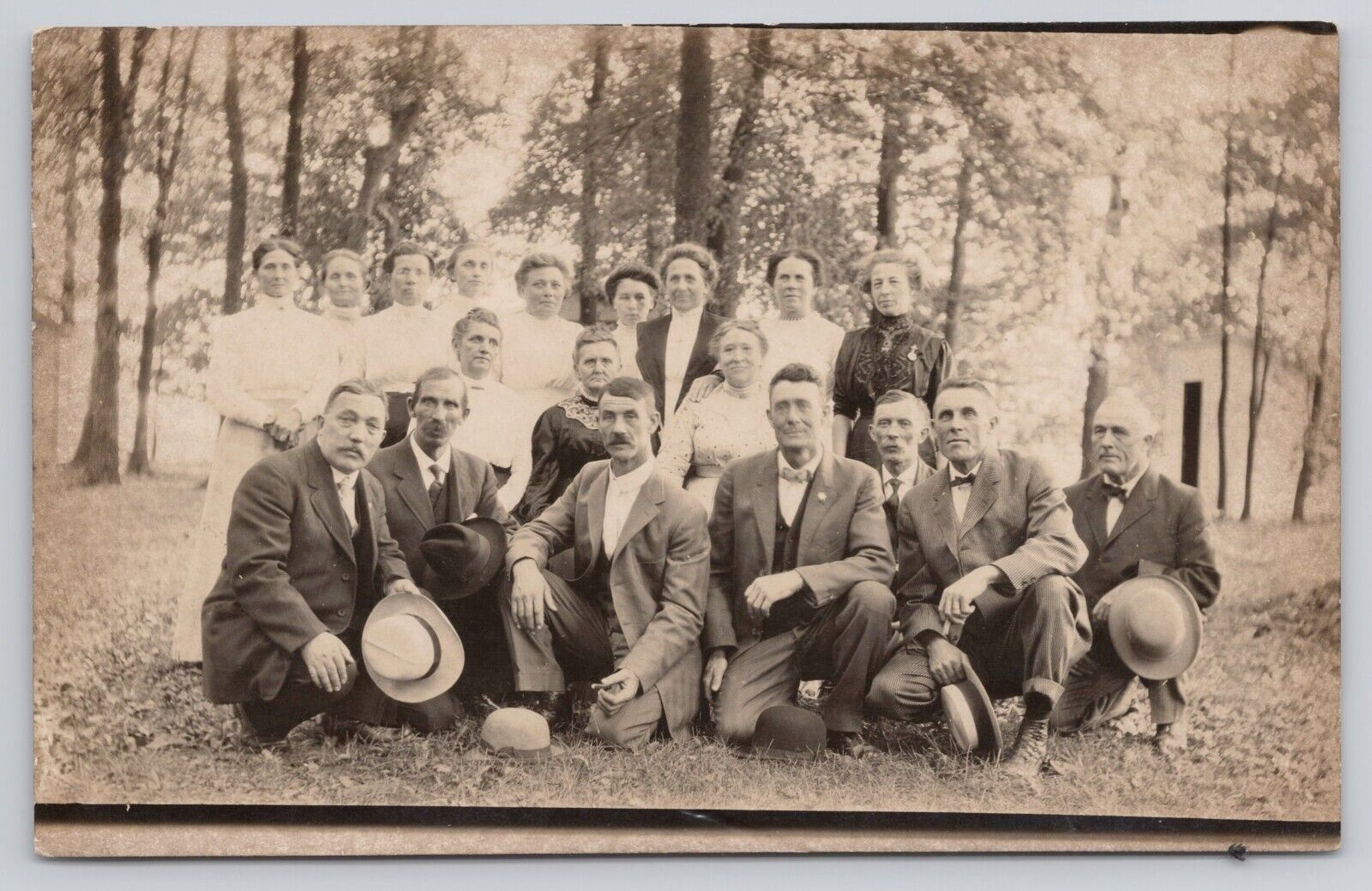 Group of Men in Suits Holding Hats and Women in Dresses c1904-1918 RPPC Postcard