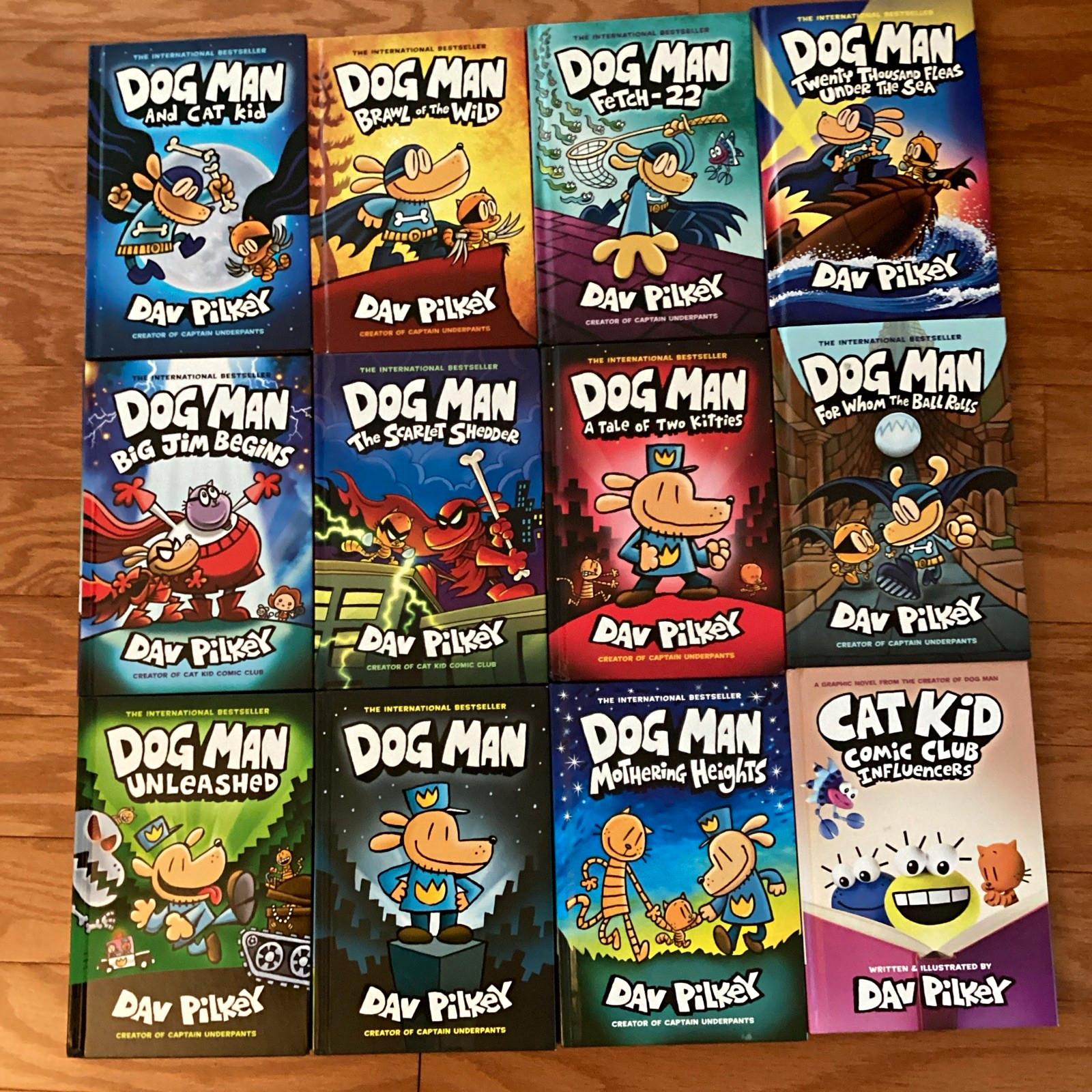 Dav Pilkey’sbDog Man & Cat Kid Lot of 12 Hard Cover books