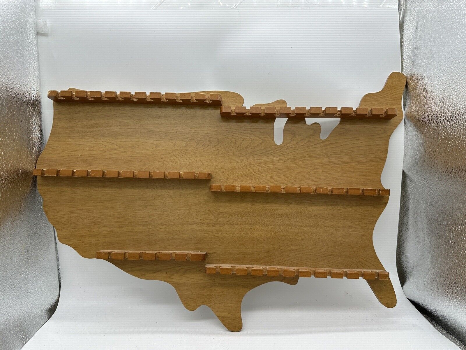 Unique souvenir spoon holder display rack shaped like map of USA