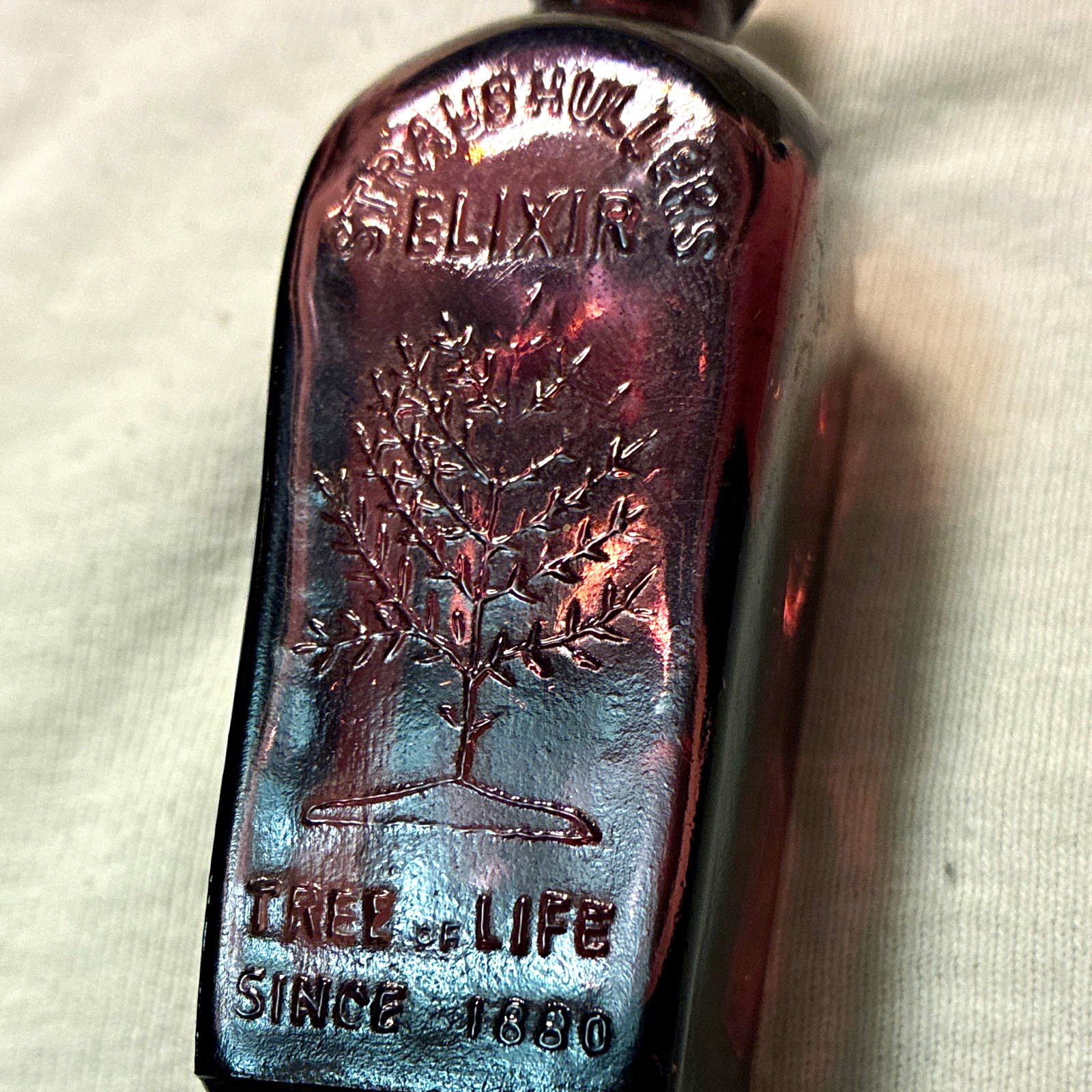 Purple Glass Miniature Bottle Embossed Straub Hullers Elixir 