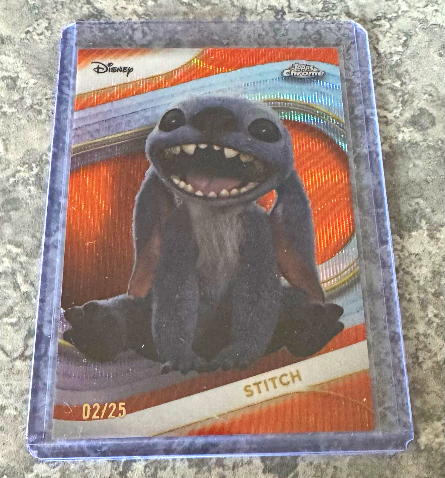 Topps 2025 Topps Chrome Disney Stitch #200 orange wave refractor 02/25