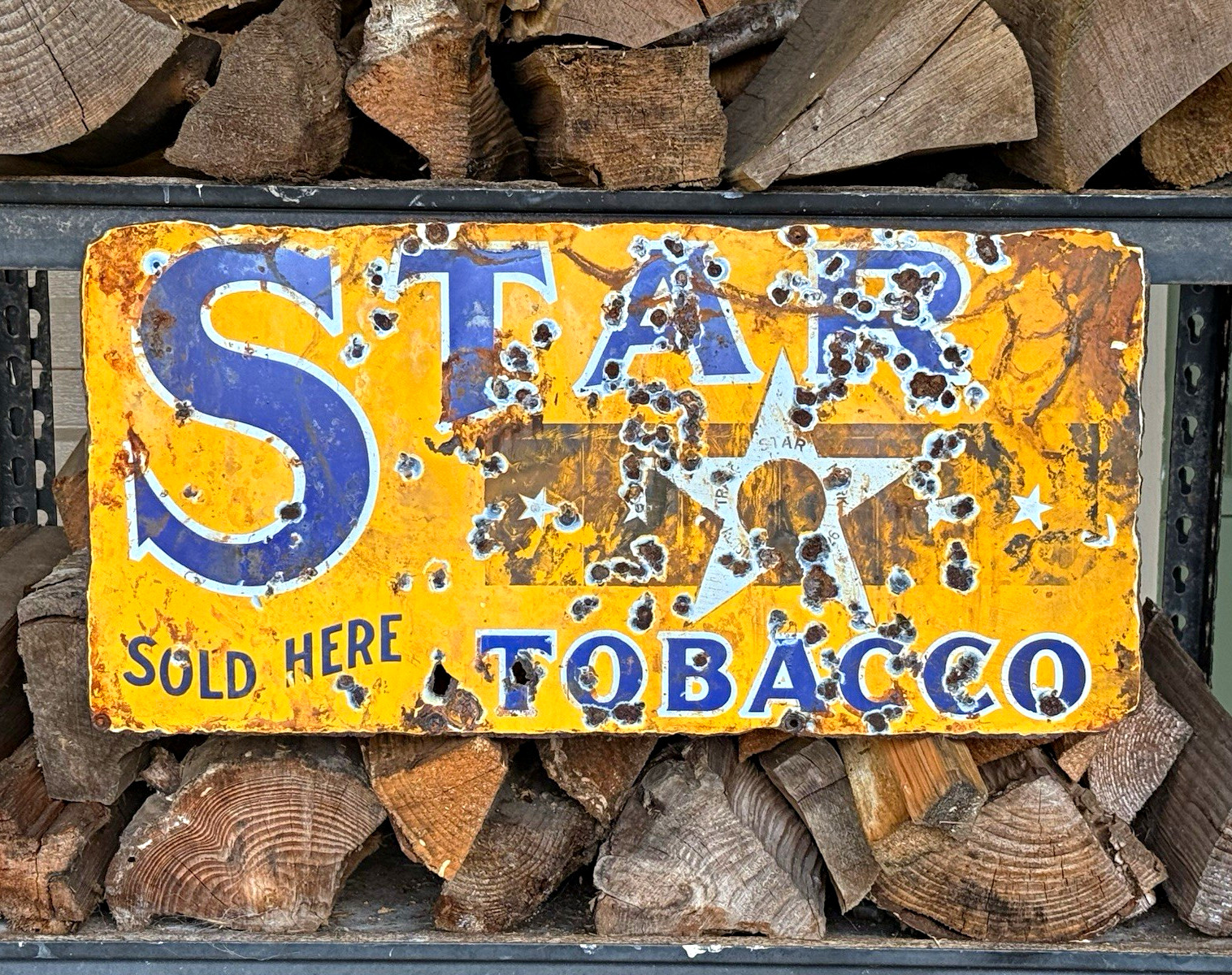 This is an absolutely unique, antique 1920s-1930s Star Tobacco advertising sign