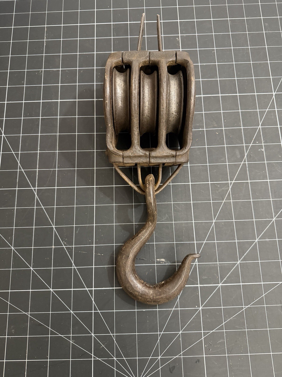 Antique Cast Iron triple pulley block with an attached iron hook