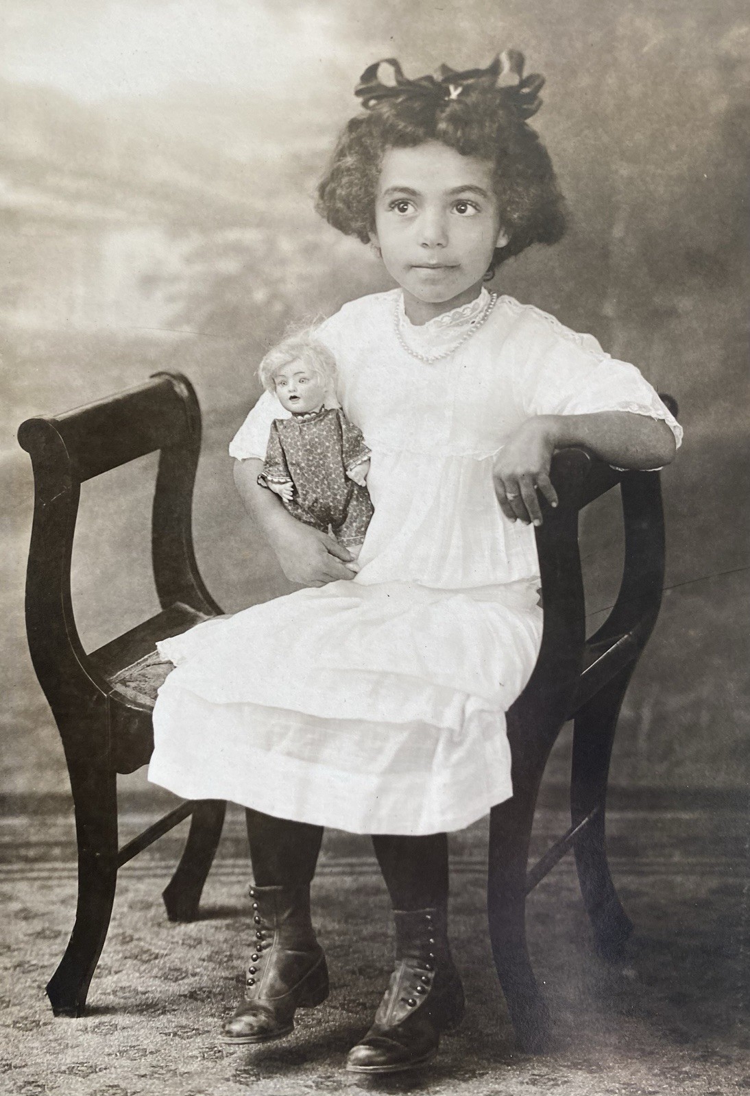 Cute Little Girl Big Brown Eyes Holding Small Bisque Doll Antique Vintage Photo