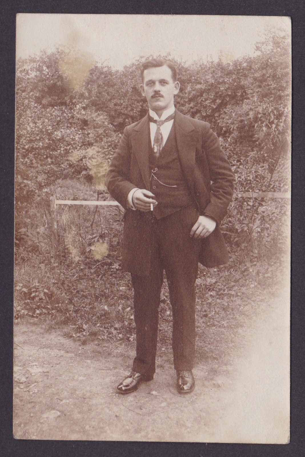 Vintage postcard Germany man smoking cigarette portrait suit RPPC