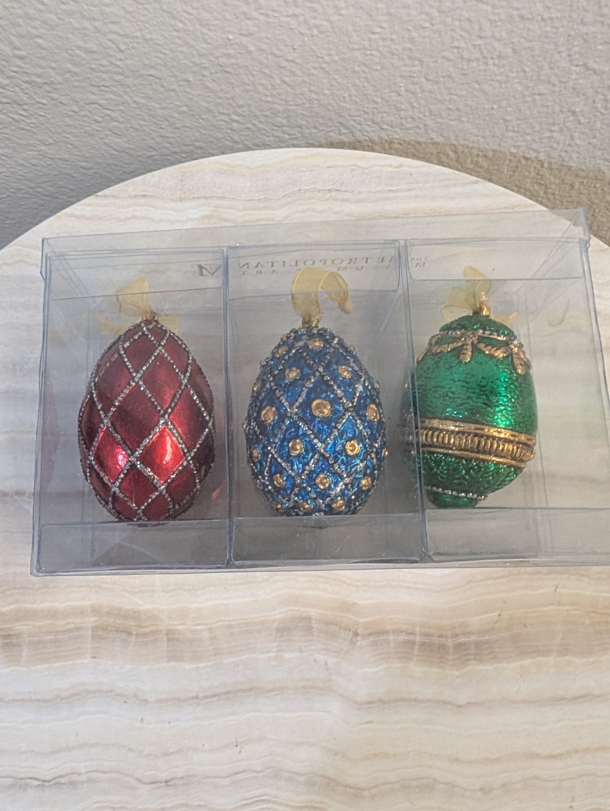 Fabergé-style decorative egg ornaments in red, blue, and green, Russian Imperial