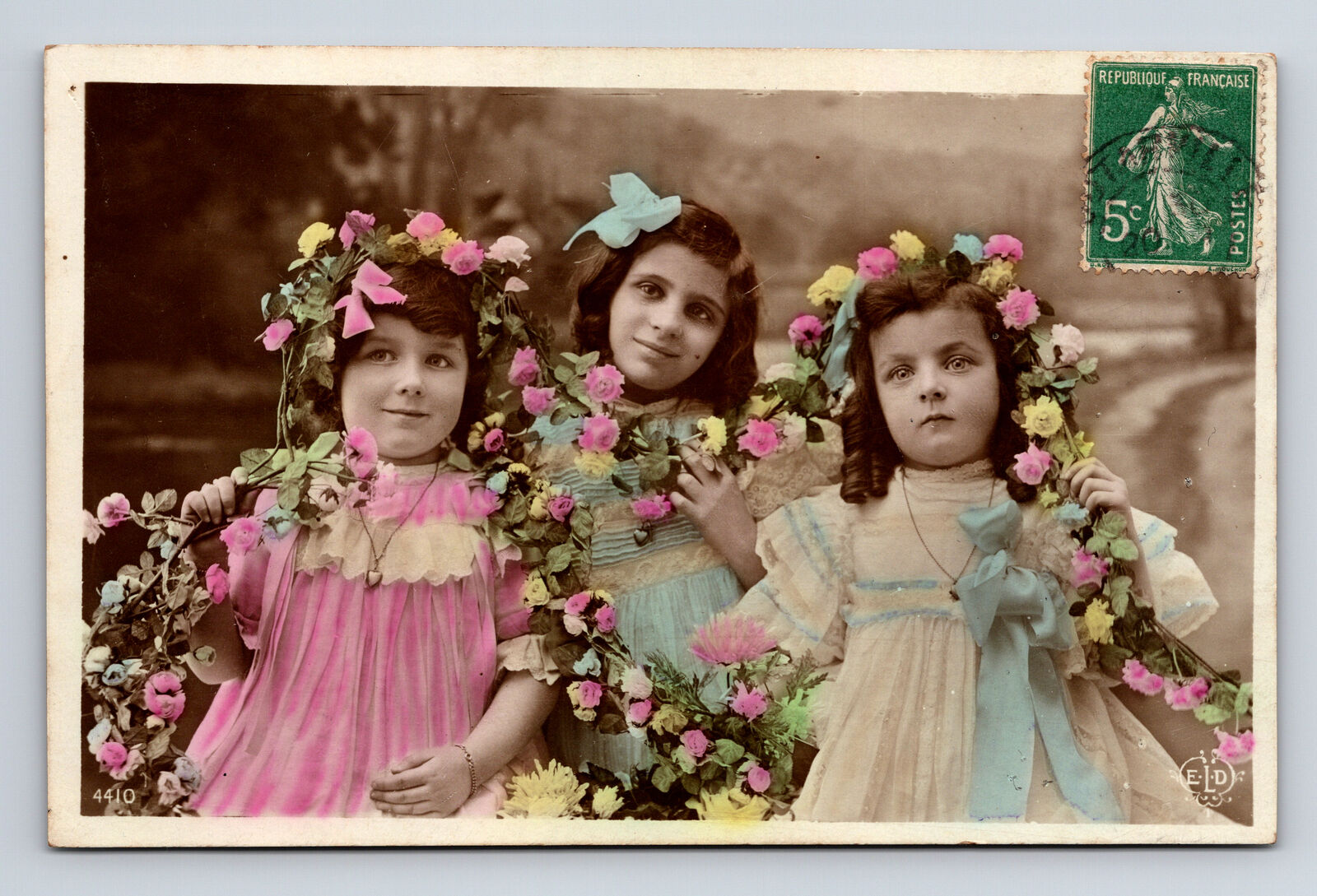 c1911 RPPC French ELD Portrait Young Girls Flowers Dress Hand Colored Postcard