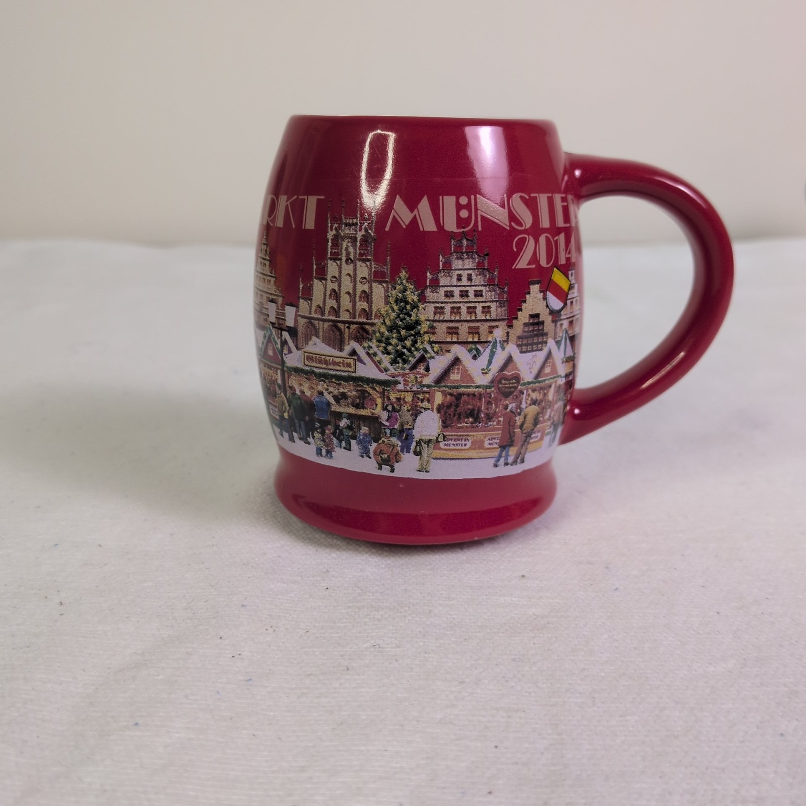 red ceramic souvenir mug from the 2014 Christmas market in Münster, Germany... red ceramic souvenir mug from the 2014 Christmas market in Münster, Germany...