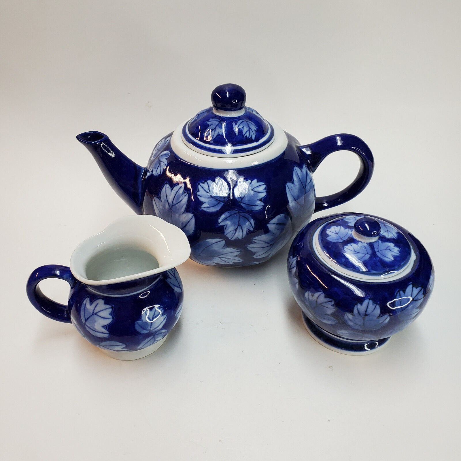 Designpac Cobalt Blue Leaf Pattern Ceramic Teapot with Matching Sugar, Cream