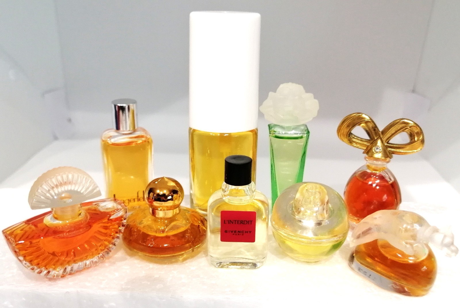 Lot of 9 Mini Bottles Collectible Fragrances by Different Designers.