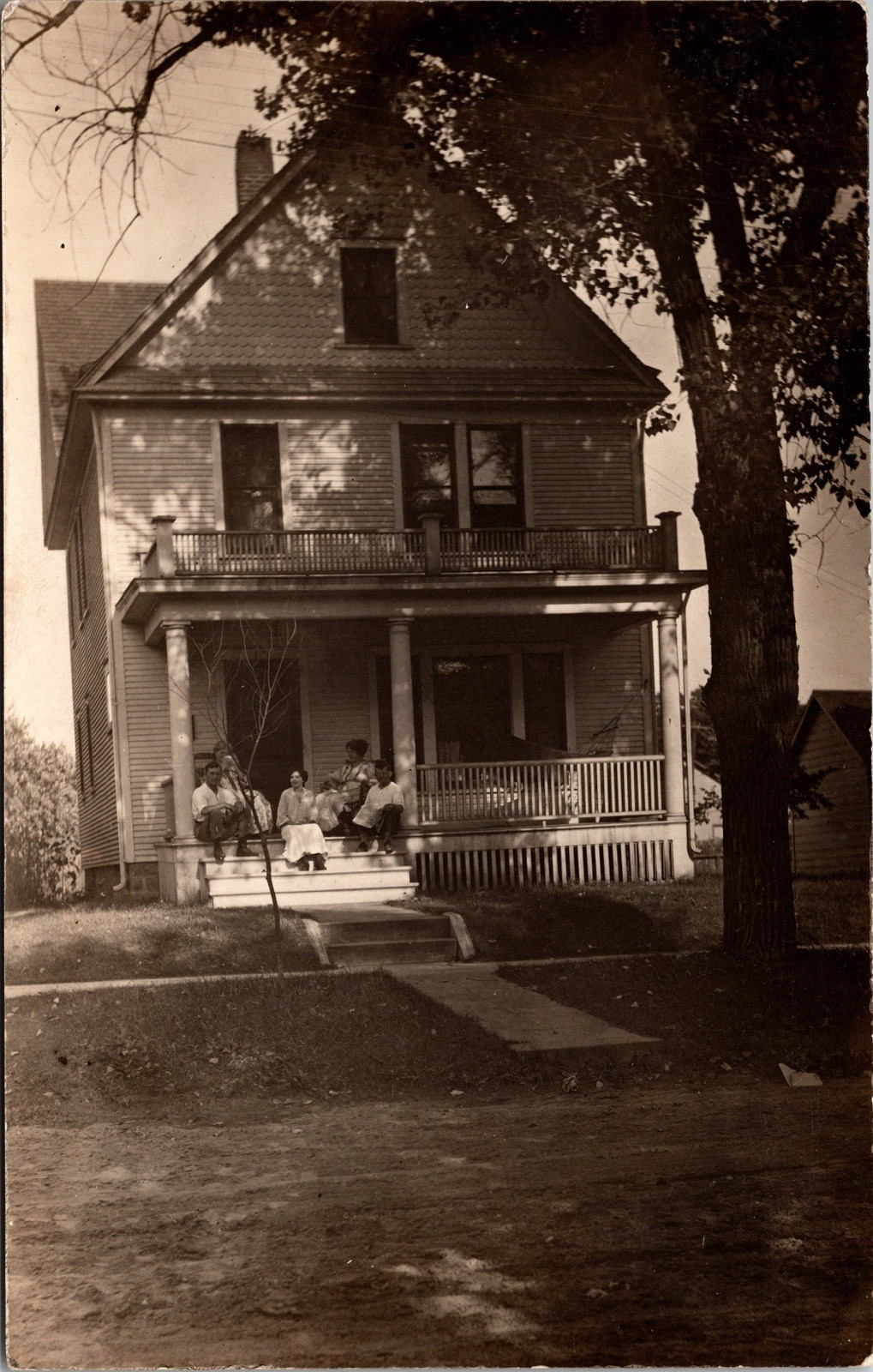 Postcard Real Photo RPPC Family Sitting on Front Porch of Nice House