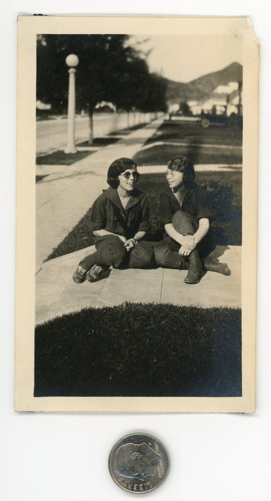 Old 1920\'s photo / Nerd Girl in Tinted Glasses Chats with Her Imaginary Friend