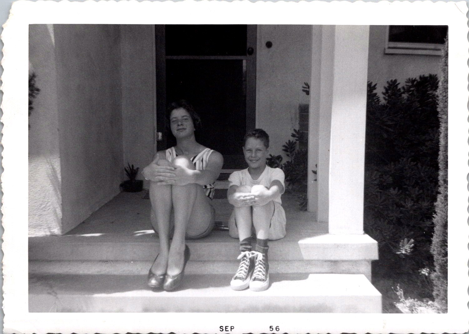 Smiling Siblings Sitting on Front Porch Steps, 1956 B&W Snapshot Photo