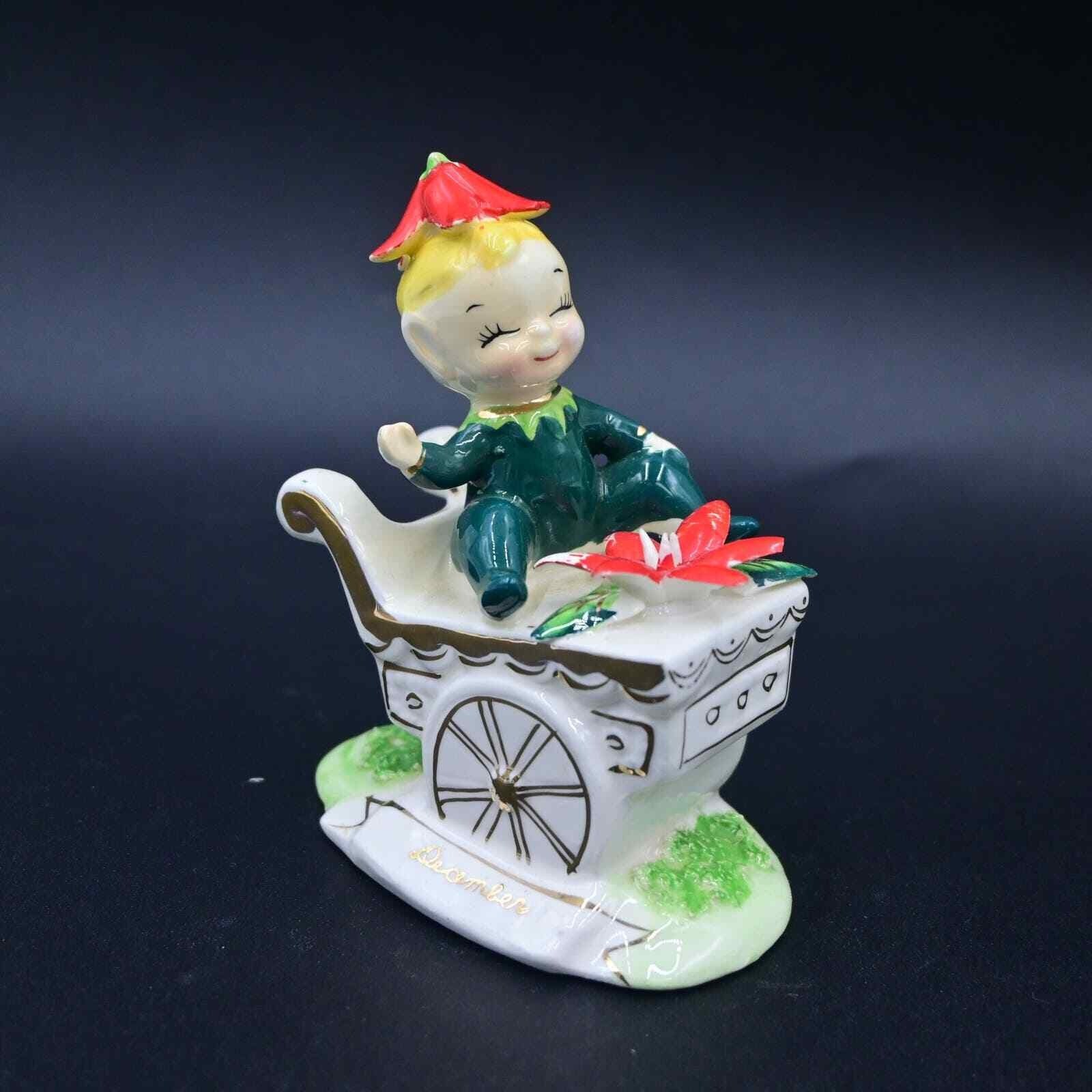 Norcrest December Poinsettia Pixie On Flowers Cart Figure Vintage F447 Norcrest December Poinsettia Pixie On Flowers Cart Figure Vintage F447