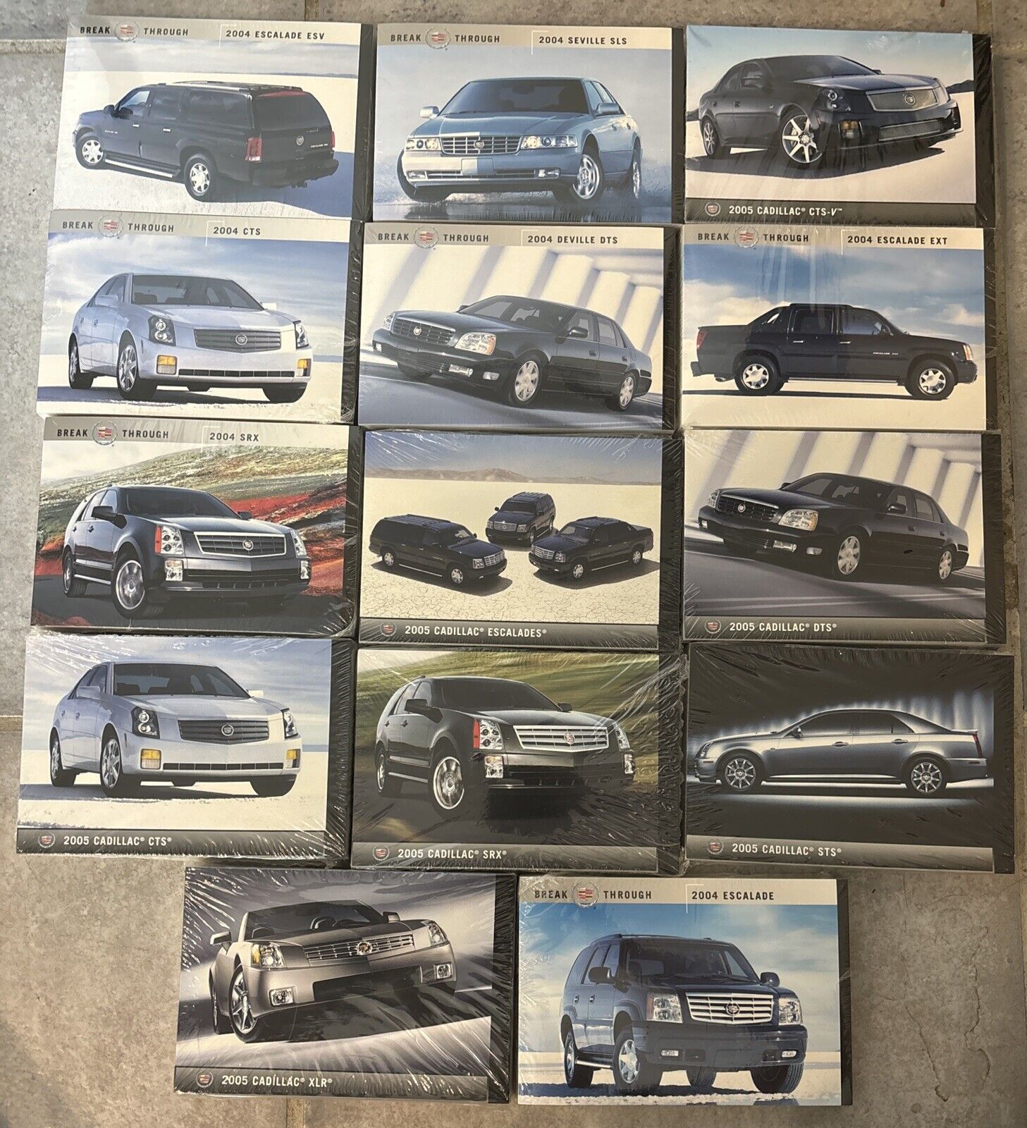 Lot Of 14 Pkgs Of 50 Count Sealed 2005 Cadillac Promotional Postcards
