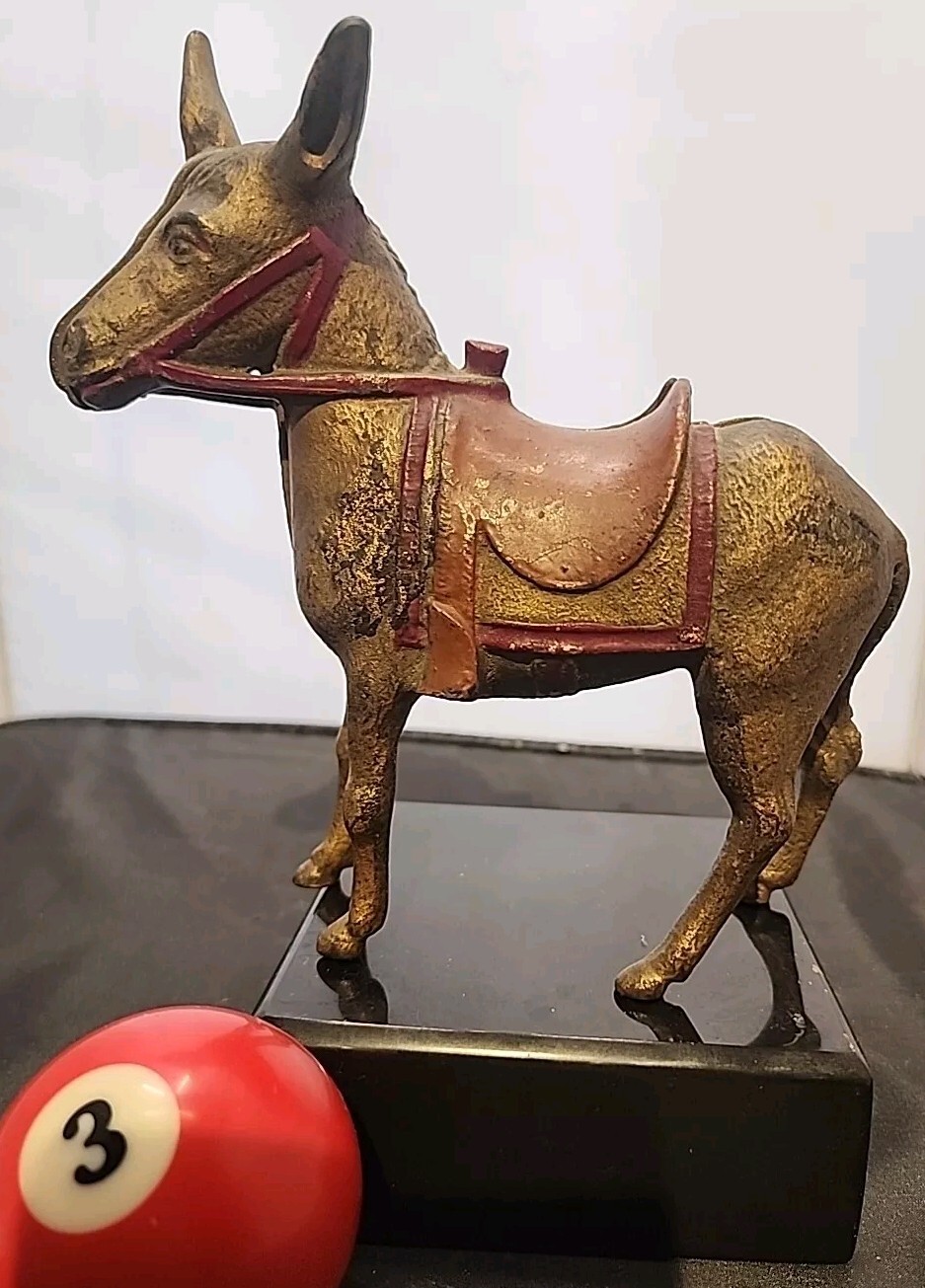 AC Wiilliams Burro donkey cast iron, still bank original gold paint , red saddle