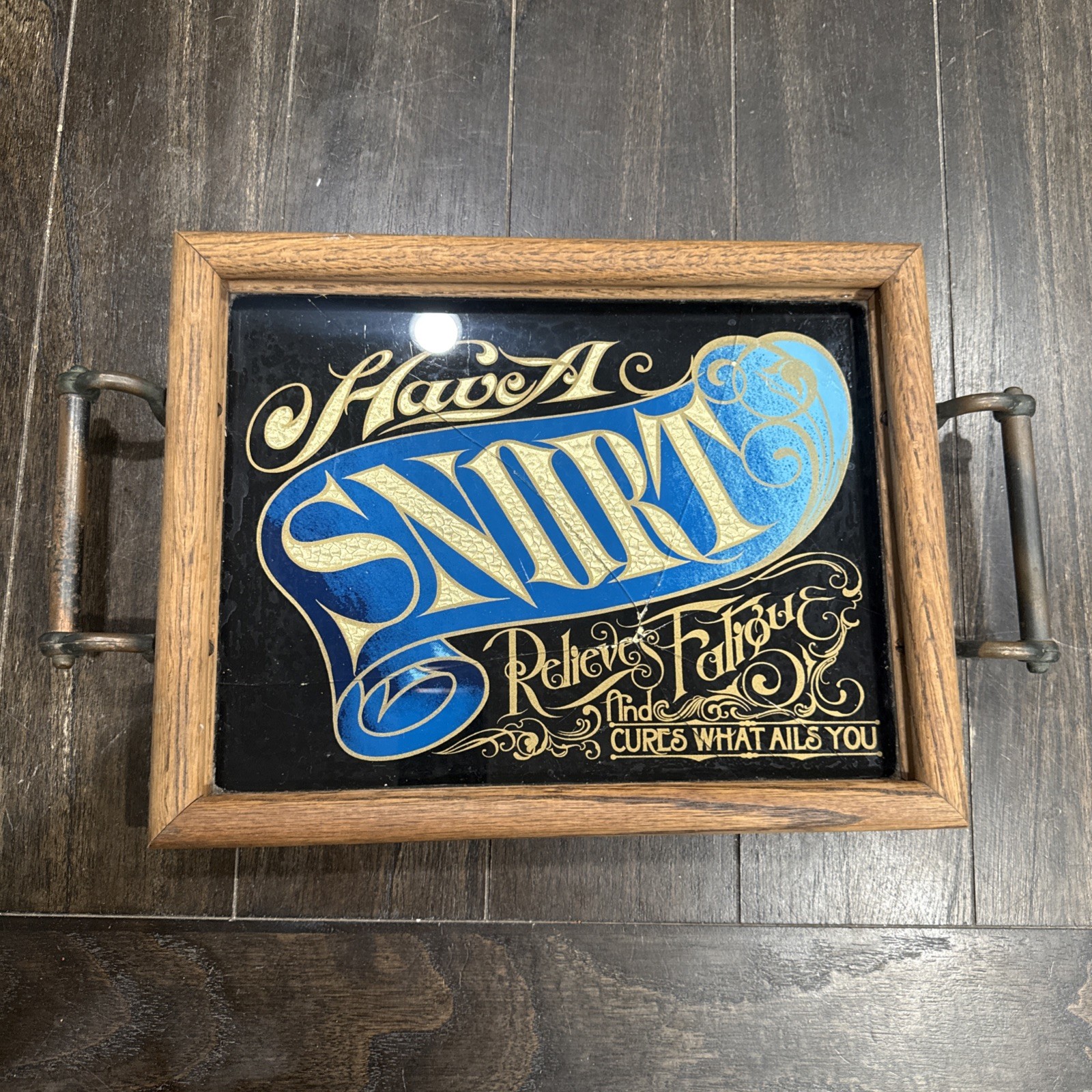 VINTAGE “HAVE A SNORT” REVERSE PAINTED GLASS SIGN WITH FOIL LETTERING HAS CRACKS