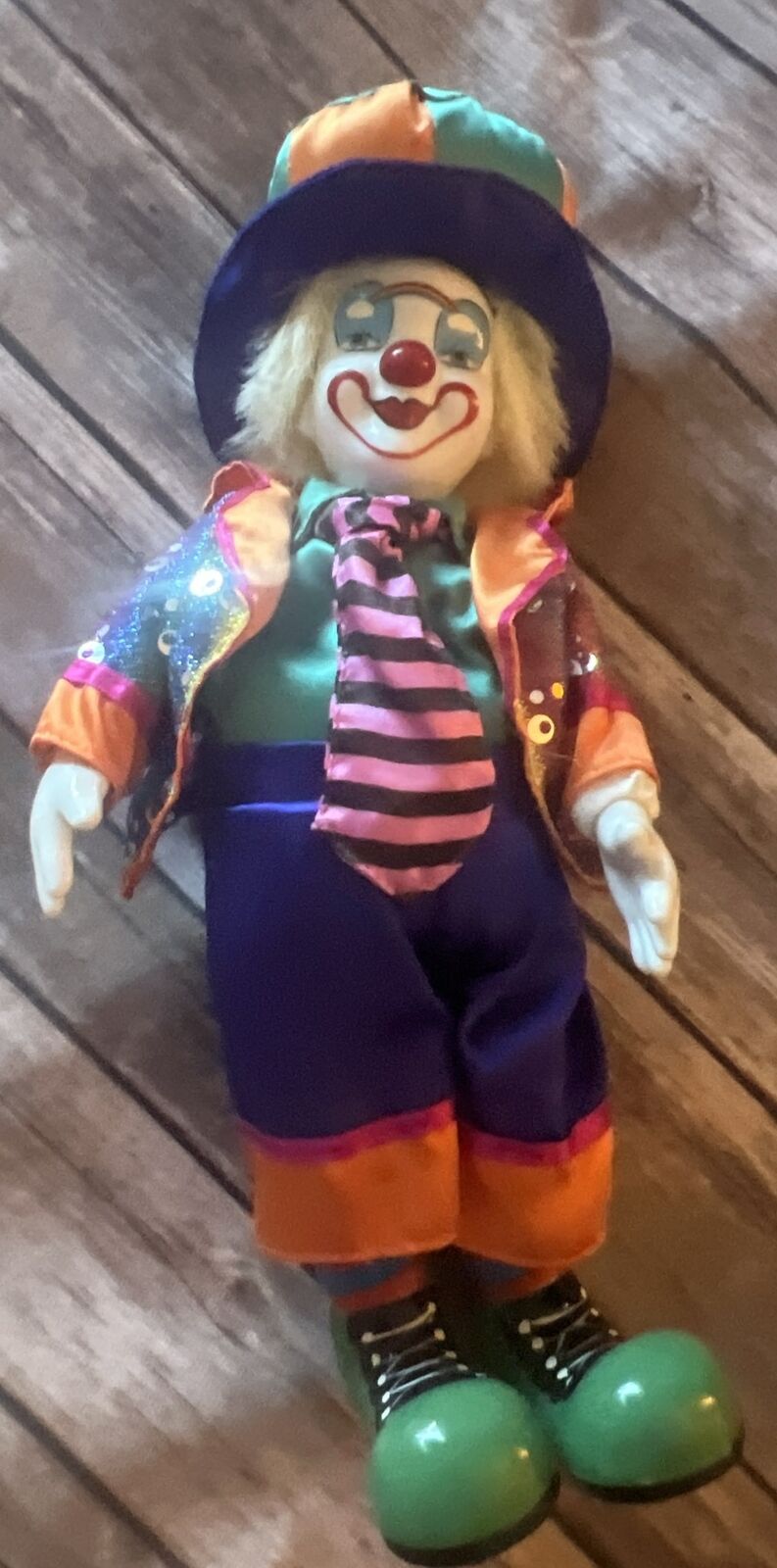 Porcelain Clown with a orange, blue, and purple hat Wind Up
