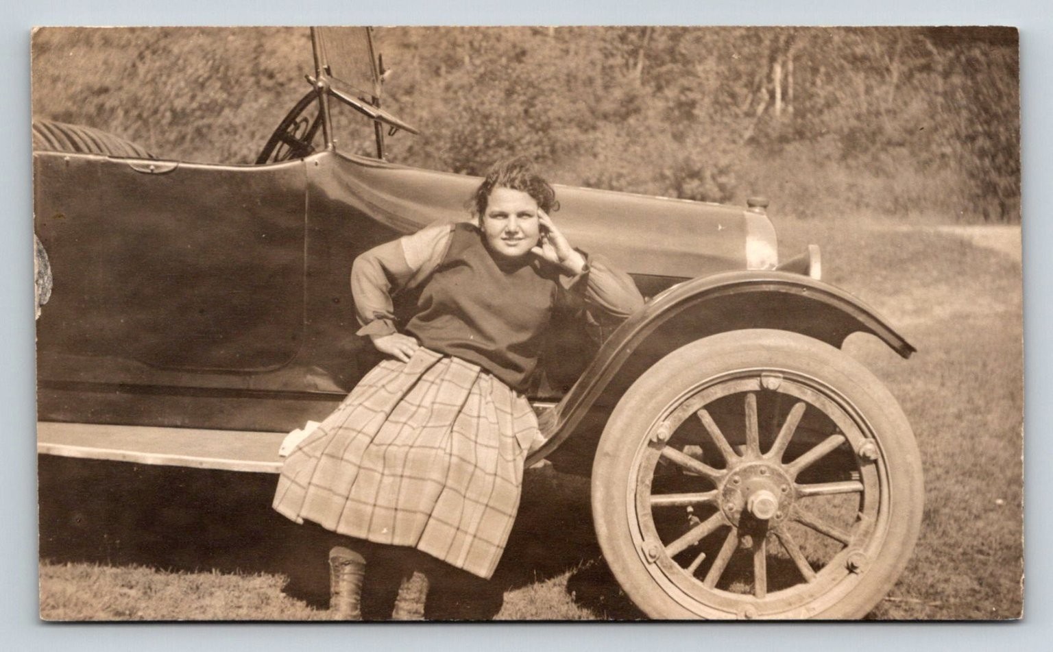 RPPC c1918 Young Woman Plaid Skirt Posing on Early Automobile Real Photo VELOX RPPC c1918 Young Woman Plaid Skirt Posing on Early Automobile Real Photo VELOX