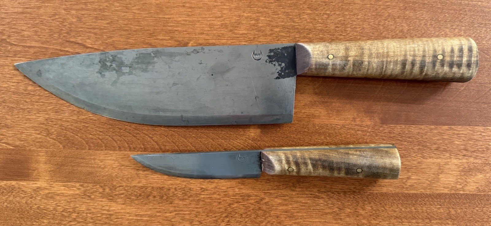 Two Jeff White Hand-Forged Curly Maple Handle Knives: 7” Trade & 12.5” Chef