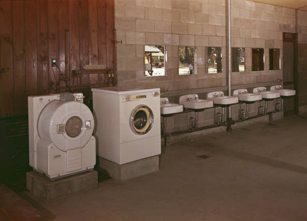 View deserted washroom which includes a clothes washer dryer addit- Old Photo