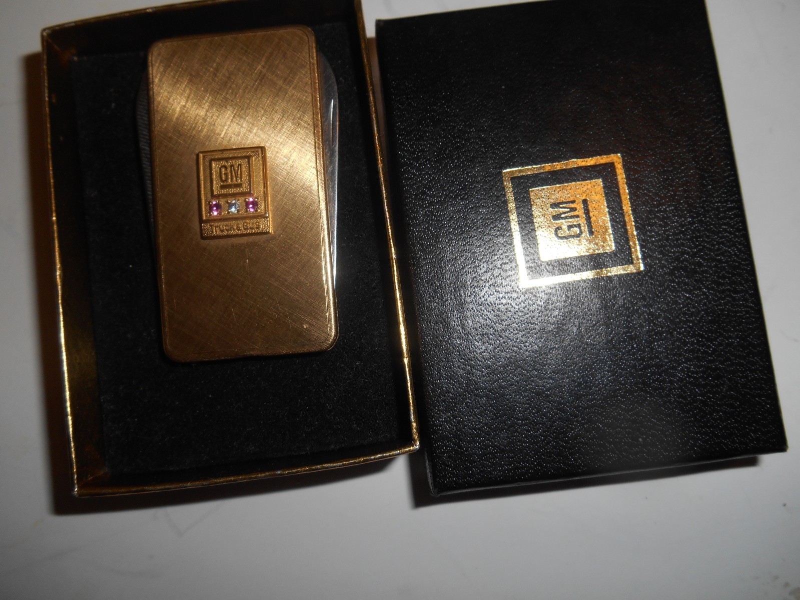 gm general motors 30yr service award. gold ruby diamond money clip pen knife