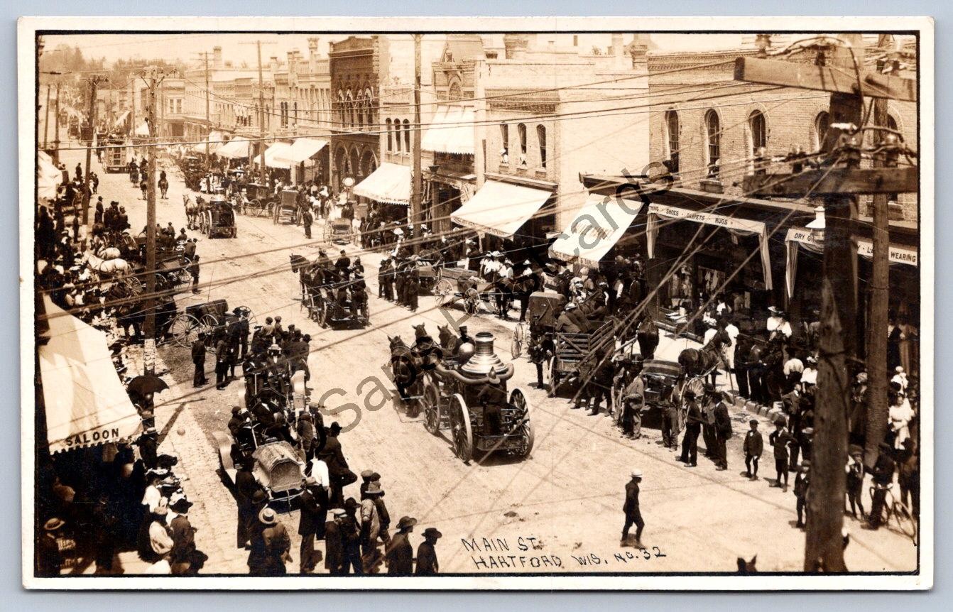 K67/ Hartford Wisconsin RPPC Postcard c1910 Main St Fire Department Parade 322