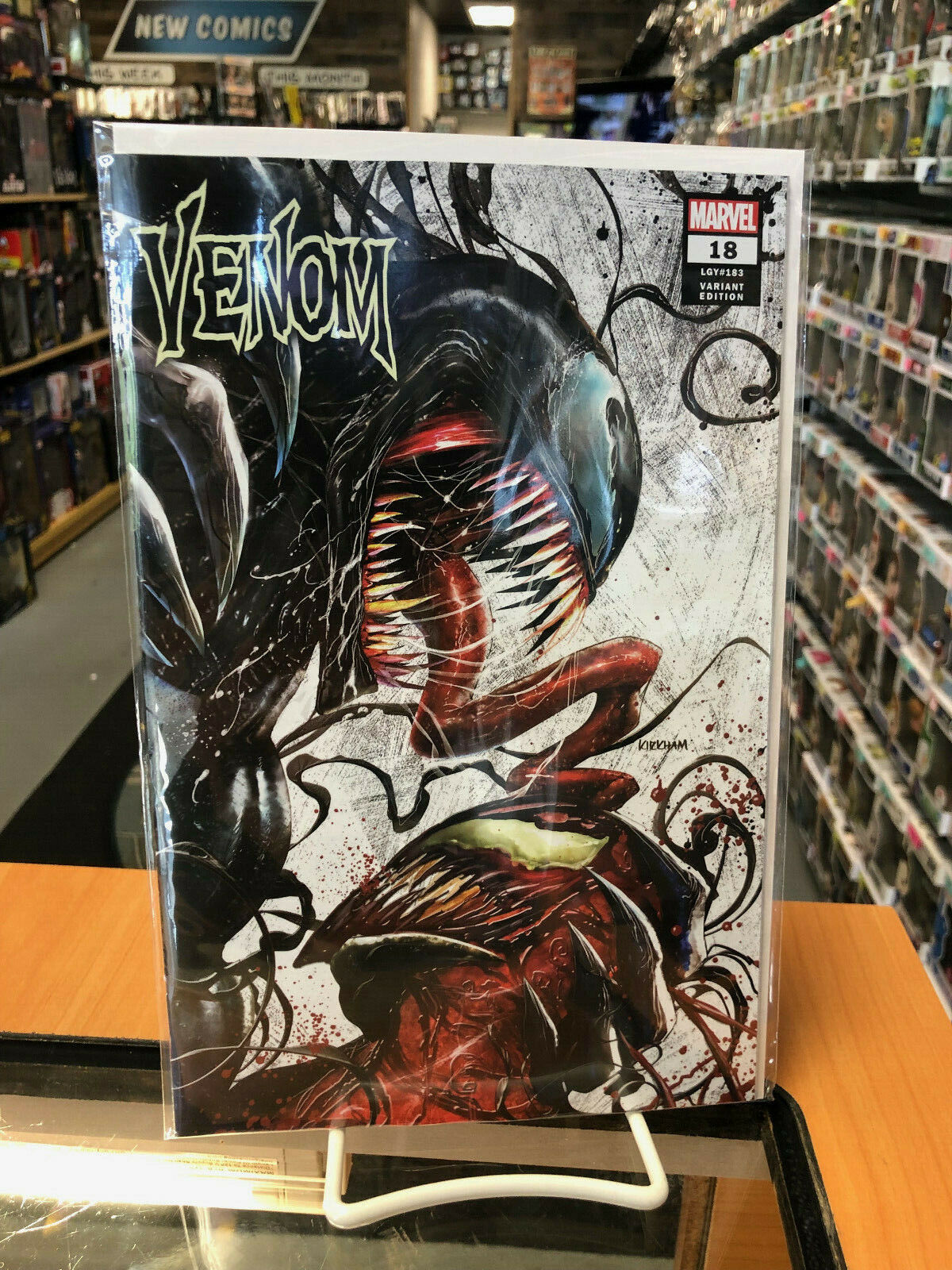 Venom 18 Tyler Kirkham Comic Spot Store Exclusive Cover A In Hand