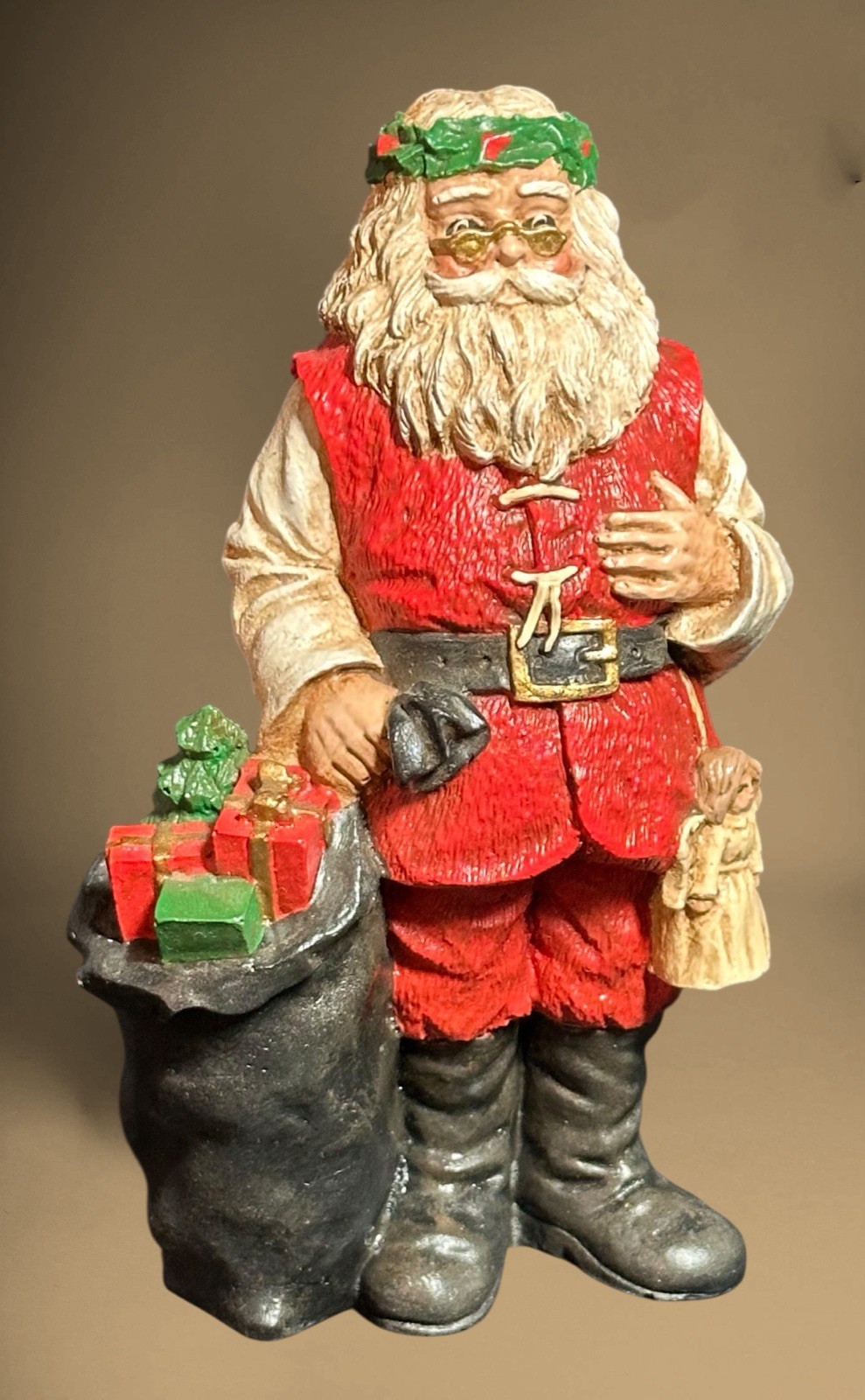Vintage Santa Wearing Wreath Headband and Holding Angel and Sack of Gifts Resin