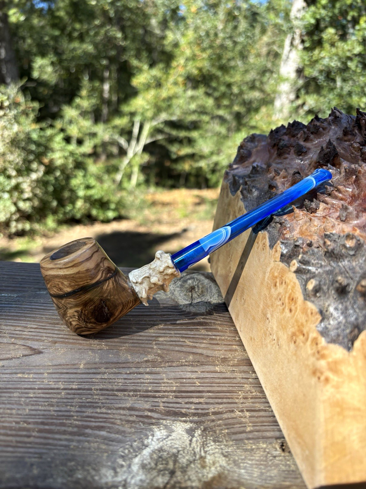 Olive burl Billards pipe with a straight blue ripple stem.