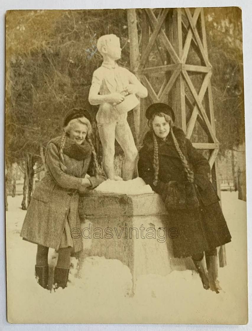 Two pretty girls Long hair Braids Beautiful face Pioneer Sculpture Russian photo