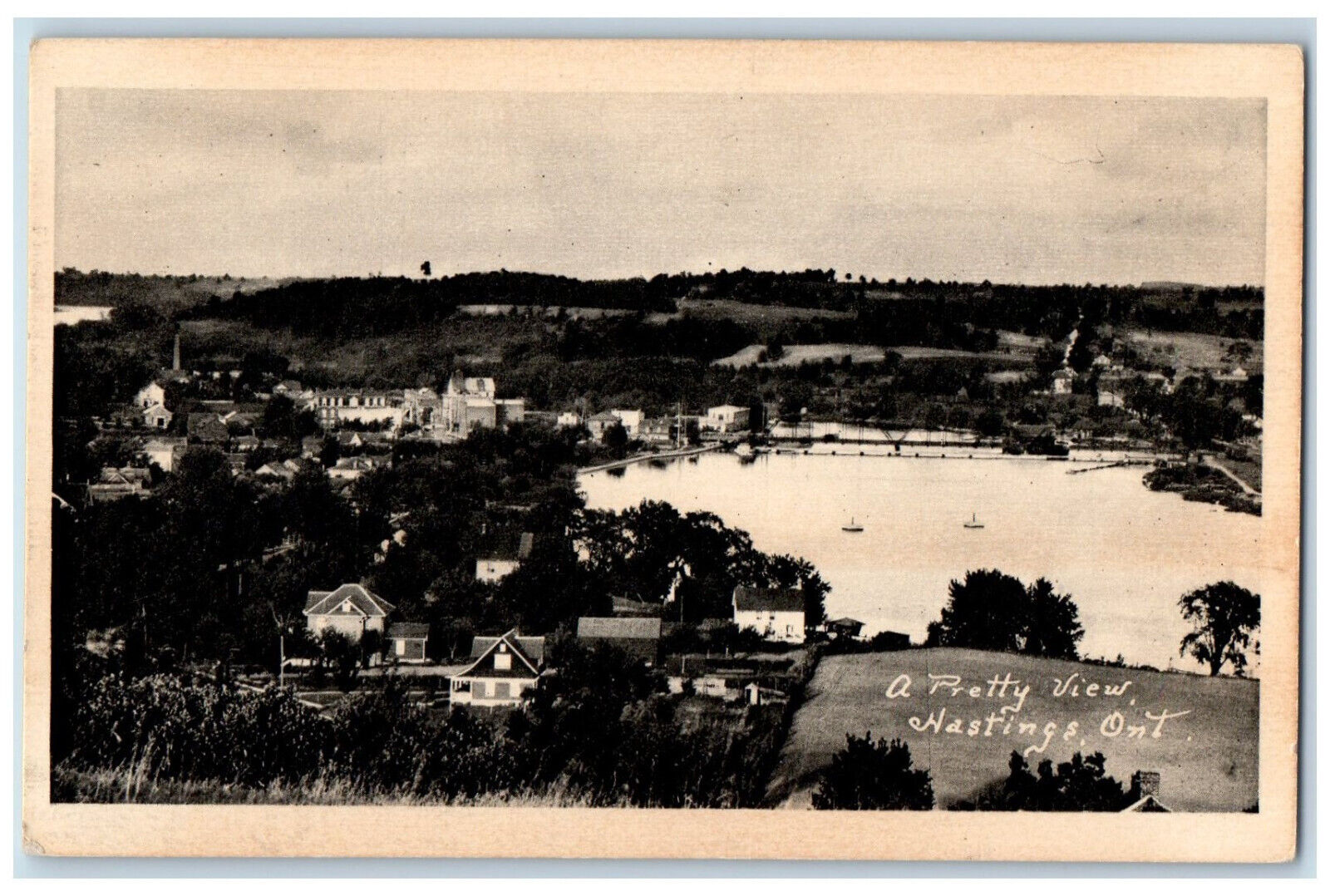 c1940\'s A Pretty View of Houses and Lake, Hastings Ontario Canada Postcard