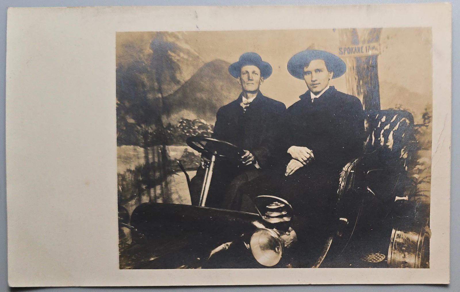 RPPC Two Men Early Automobile Spokane 10 Miles Sign Real Photo