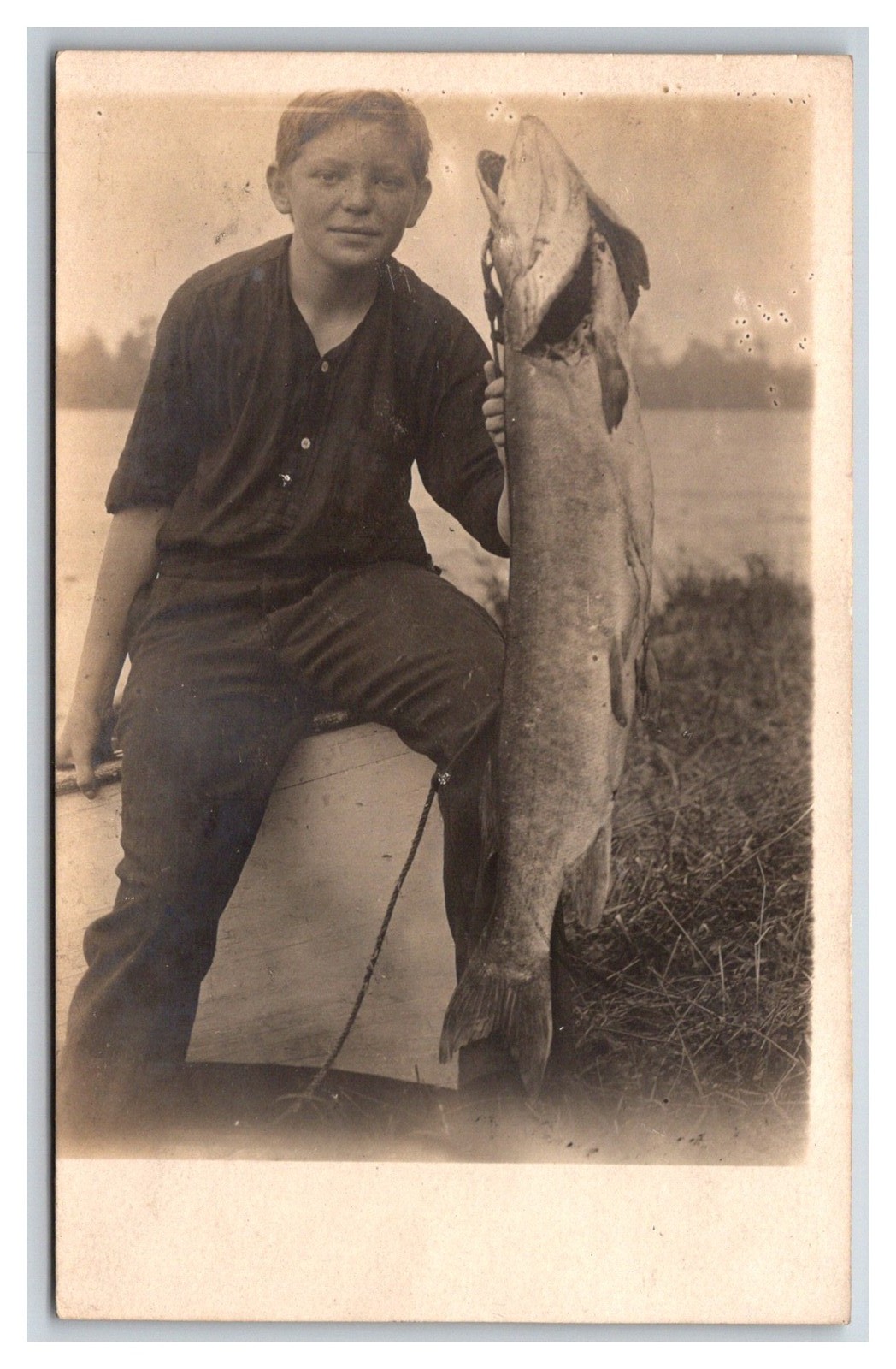 RPPC ~ Young boy Fisherman W giant Muskie ~ Fishing hunting
